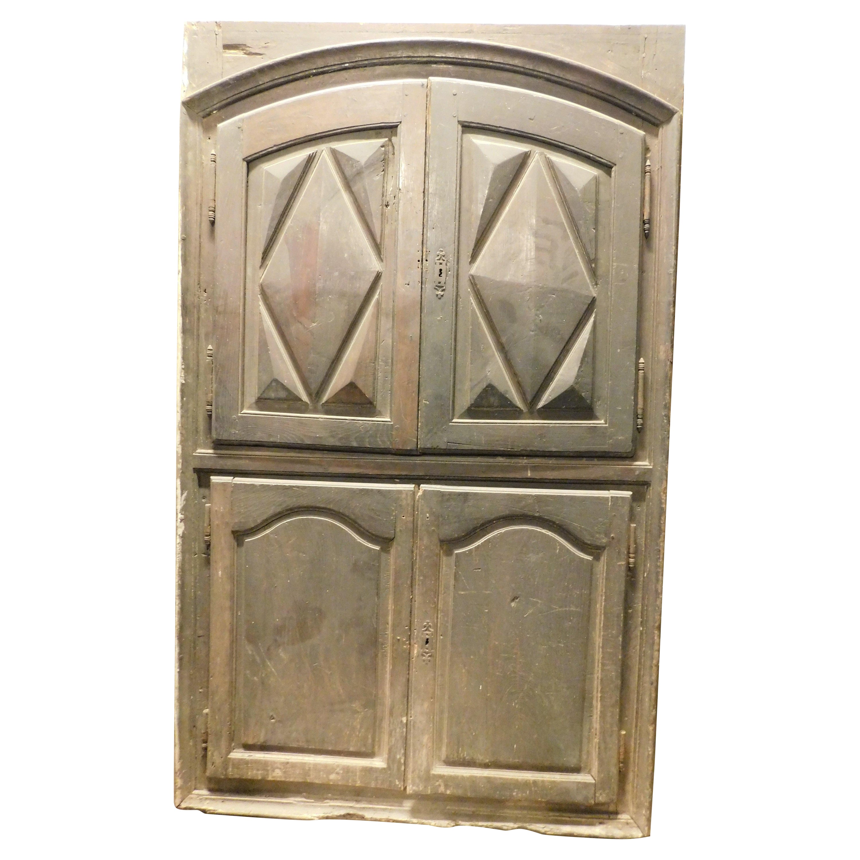 Placard, wall cabinet, carved in chestnut with diamond-point panels, Italy