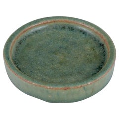 Arne Bang, own workshop. Small ceramic dish decorated in blue-green glaze.