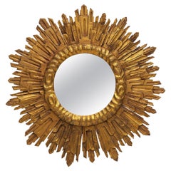 Gran espejo dorado francés con forma de estrella o de sol (diámetro 27 1/2)