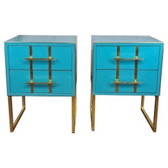 Turquoise murano glass bedside tables, brass work and gray velvet interior