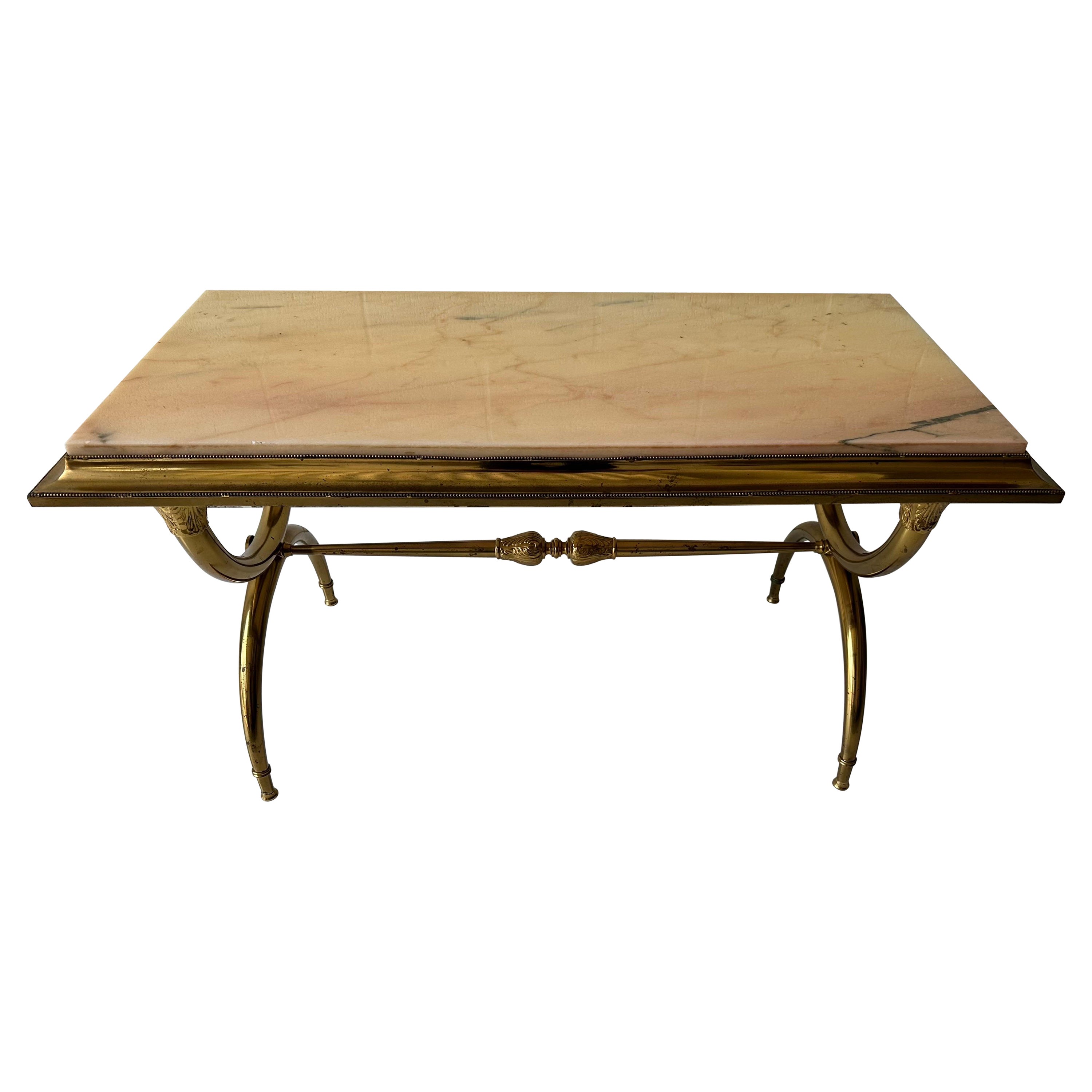 Raymond Subes style marble top and brass coffee table .