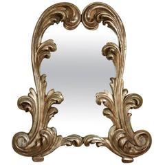 An Exuberant Carved and Silver Gilt Italian Mirror, provenance: Tony Duquette