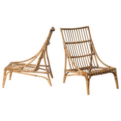 Paire de chaises longues en rotin dans le style d'Audoux Minnet - France années 1960