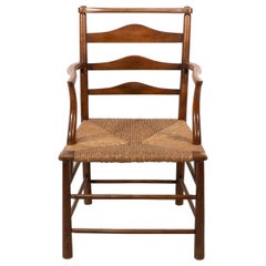 C R Ashbee. An Arts and Crafts rush seat ladder back armchair