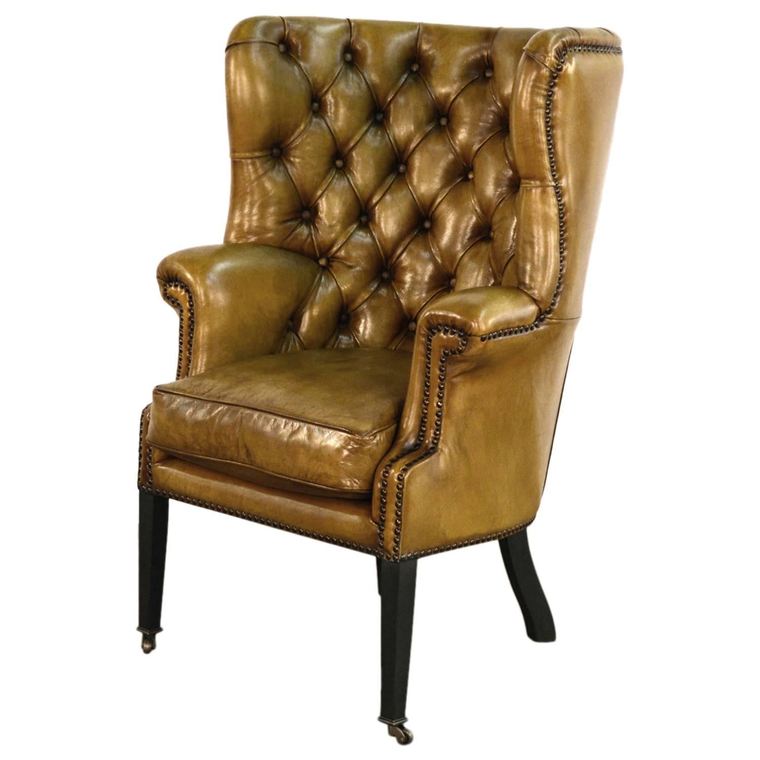 Upholstered Wing Chair in Vintage Green Leather For Sale