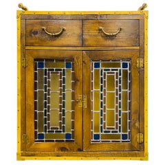 Vintage rustic stained glass two door cabinet by Habersham