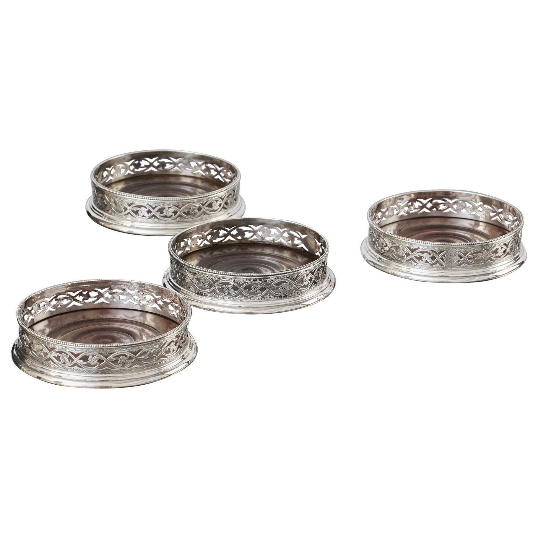 Matched set of four early-George-III pierced silver wine coasters For Sale