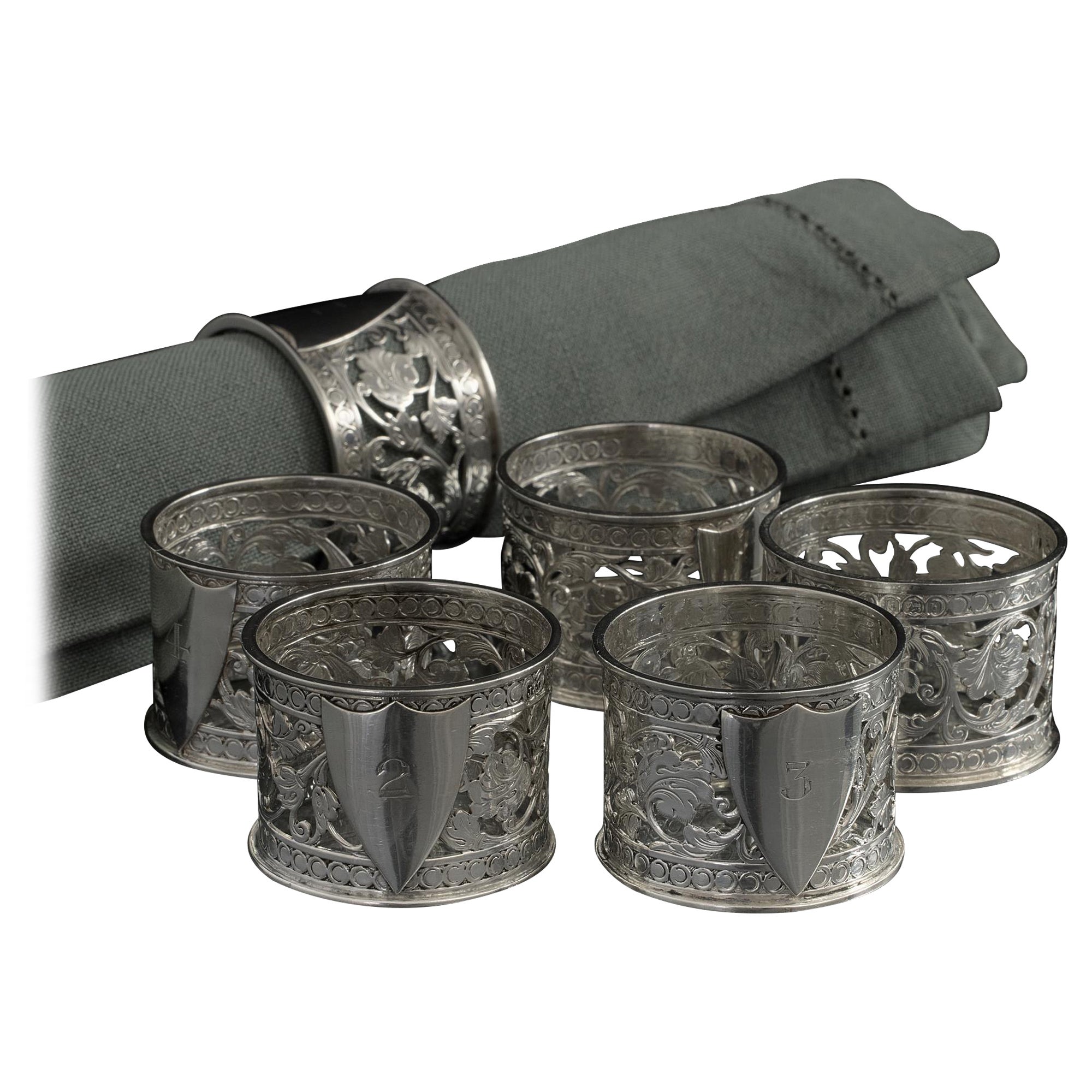 Set of six numbered silver napkin rings For Sale
