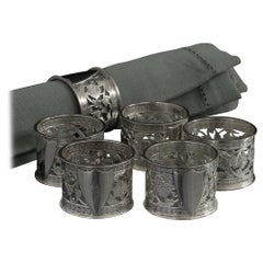 Set of six numbered silver napkin rings