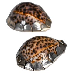 Pair of Gabriella Crespi shells with hand-decorated silver metal application