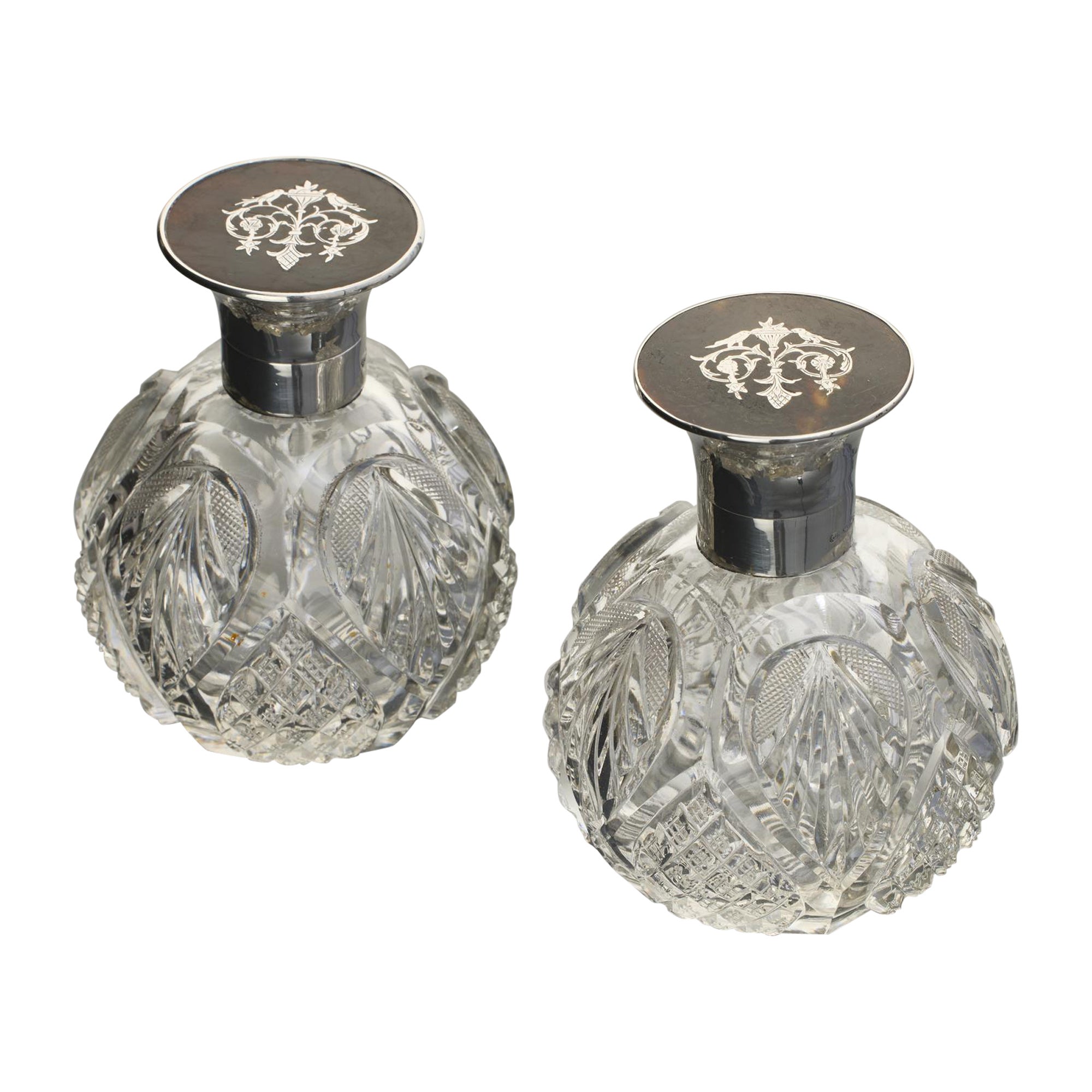 Pair of antique cut glass perfume bottles with silver & tortoiseshell covers For Sale