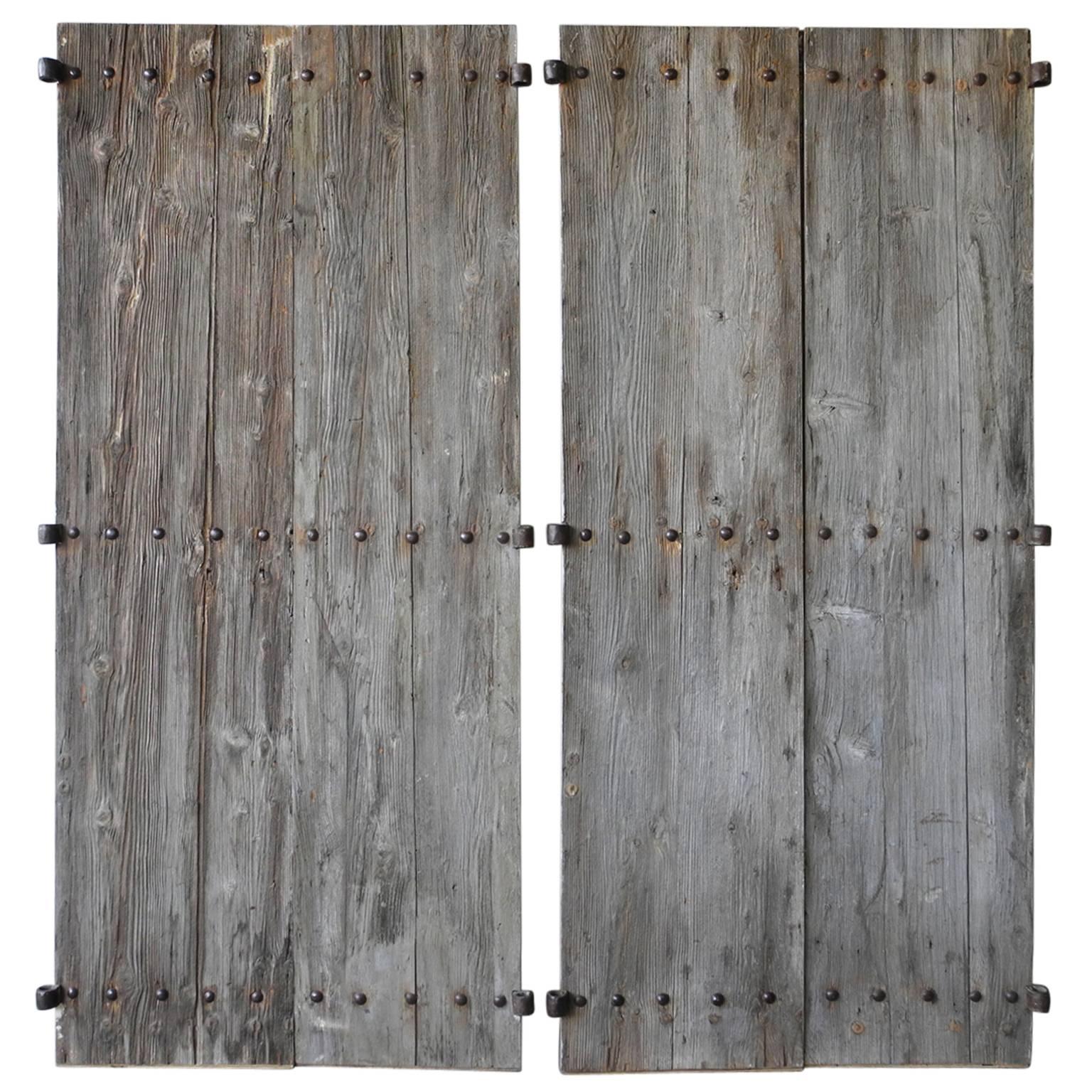 Two pairs of antique 18th century shutters from a chateau in Beaucaire, France.