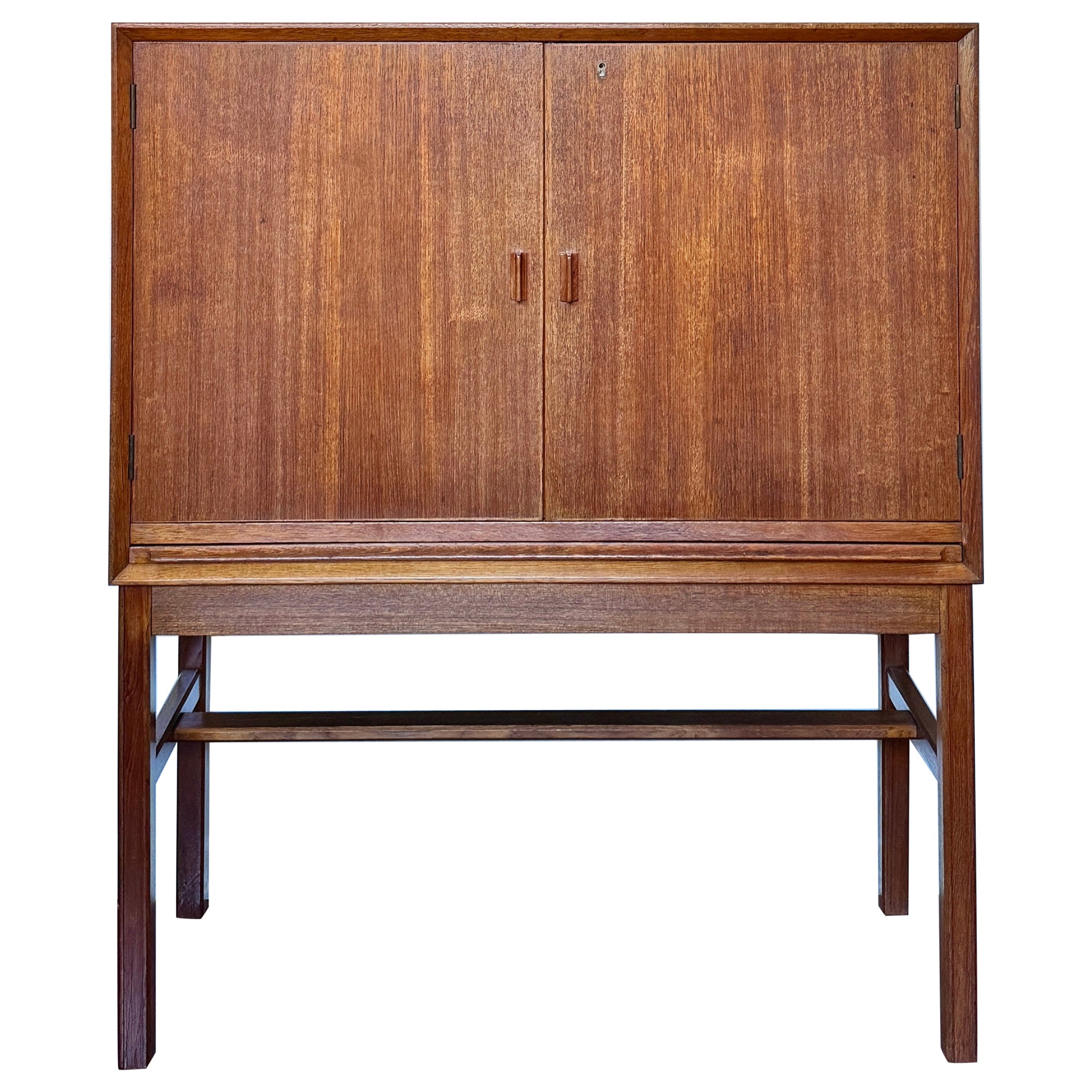 A rare mid century modern tall bar cabinet with a pull out surface For Sale