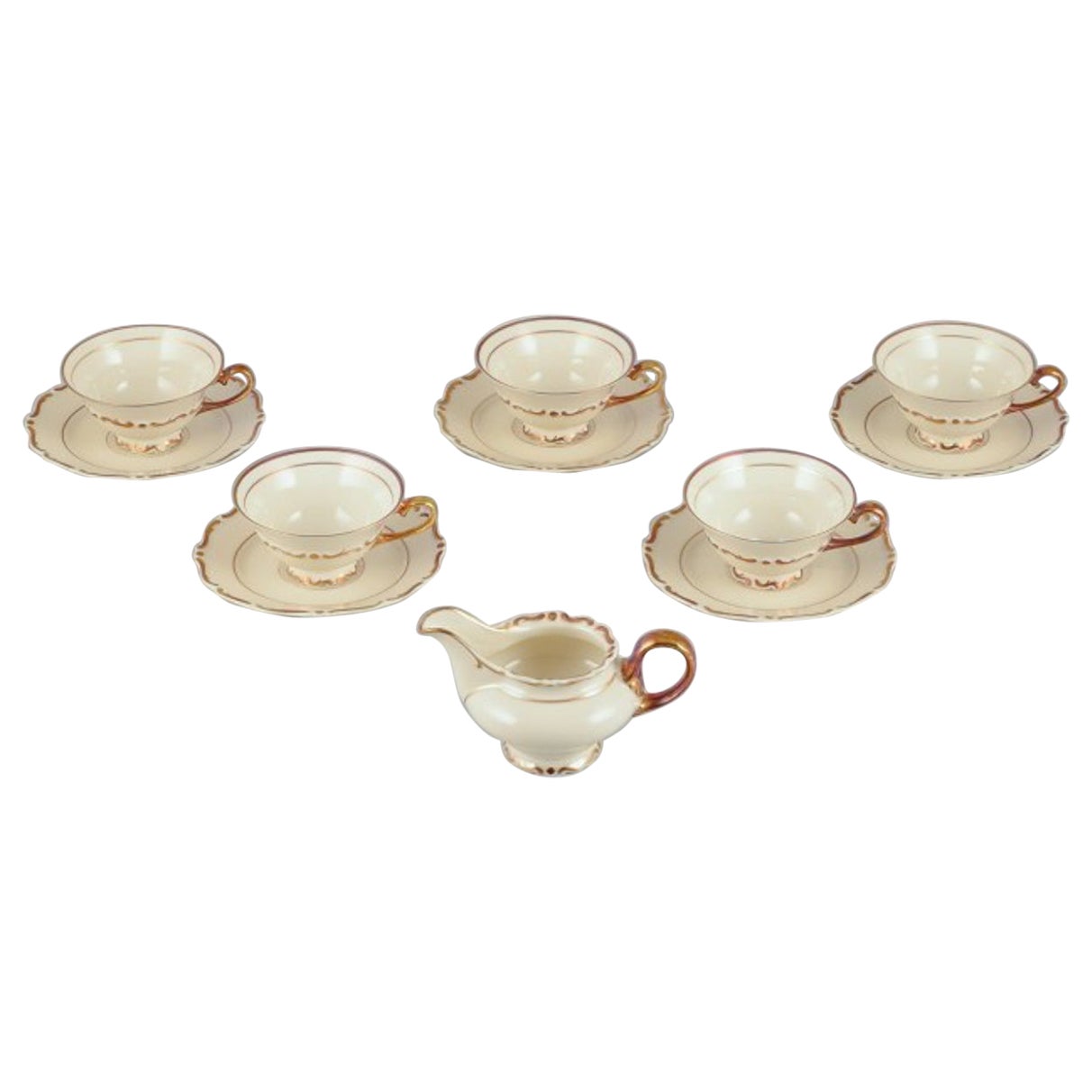 Set of five KP, Karlskrona tea cups with saucers and a creamer For Sale