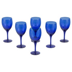 Monica Bratt for Reijmyre. Set of six red wine glasses in blue art glass.