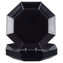 Arcoroc, France. A set of six octagonal plates in black porcelain. 