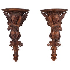 Antique Pair of carved wooden corbels. Venice, 19th century. 