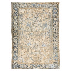 Tapis persan ancien Heriz en laine beige et bleu