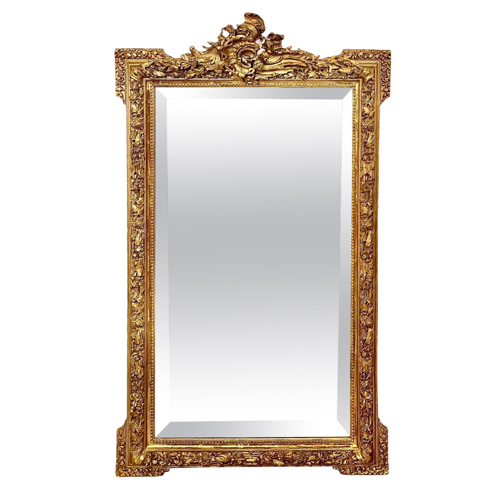 Miroir en bois doré orné Louis XVI du 19ème siècle