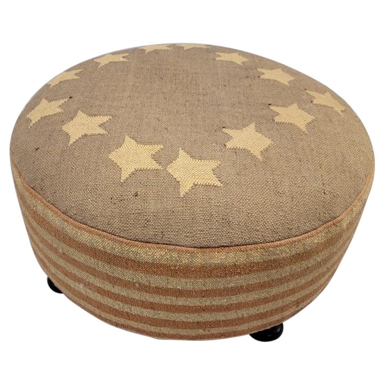 Vintage Rustic Betsy Ross Recycled Kilim Rustic American Flag Ottoman

A handwoven American flag has been recycled to upholster this vintage round ottoman. The flag is a type of tapestry known as kilim, an ancient method hand-weaving originating
