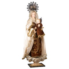 Antique Virgin of Carmel to dress. Wood, metal and textile. Spanish school, 19th century