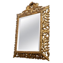 Miroir français en bois sculpté et doré