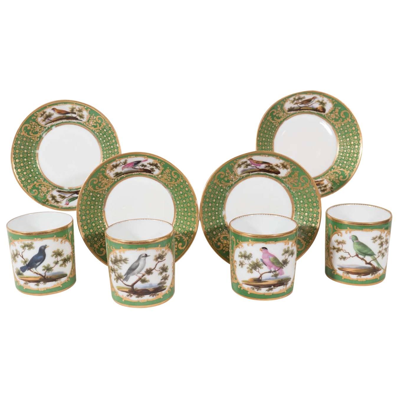 Four Paris Porcelain Coffee Cans with Hand-Painted Birds on a French Green Groun