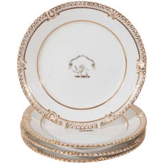 A Pair of Armorial Porcelain Plates in White and Gold