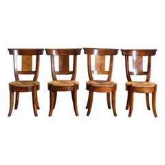 Ensemble de quatre chaises provinciales en noyer d'époque Empire, 1er quart 19e s.