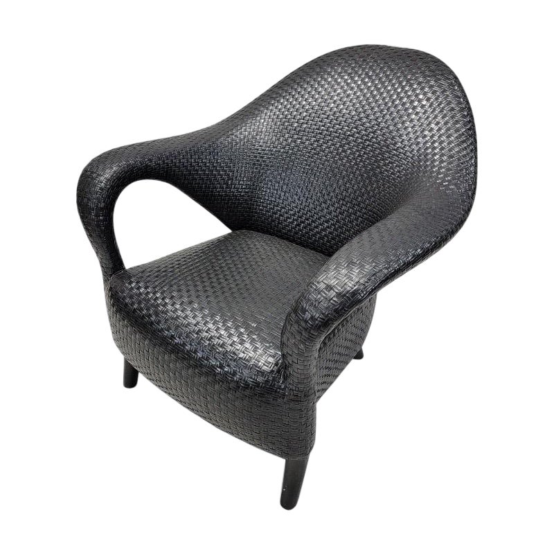 Vintage Italian Sculptural Woven Leather Rattan Style Lounge Chair

This sculptural vintage armchair was woven from leather strips. Its dark neutral coloring makes it perfect for a variety of spaces. Whether in your living room or commercial space,