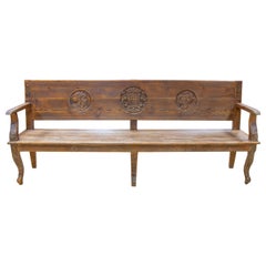 Spanish Bench with Wooden Arms with Hand-Carved Head Decorations