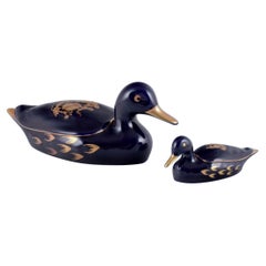 Vintage Limoges, France. Two porcelain ducks decorated with 22-karat gold leaf.