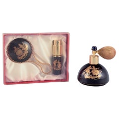 Limoges, France. Two porcelain perfume atomizers and a makeup mirror