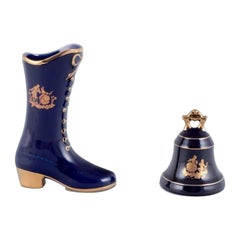 Limoges, France. Porcelain boot and table bell decorated with 22-karat gold leaf