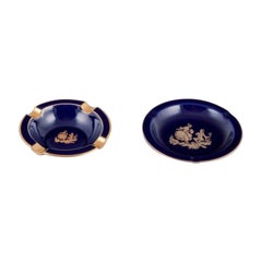 Limoges, France. Two small porcelain bowls decorated with 22-karat gold leaf.