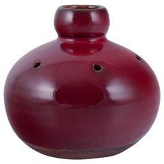 Vintage Gerard Hofmann, French ceramicist. Perforated vase with ox blood glaze.