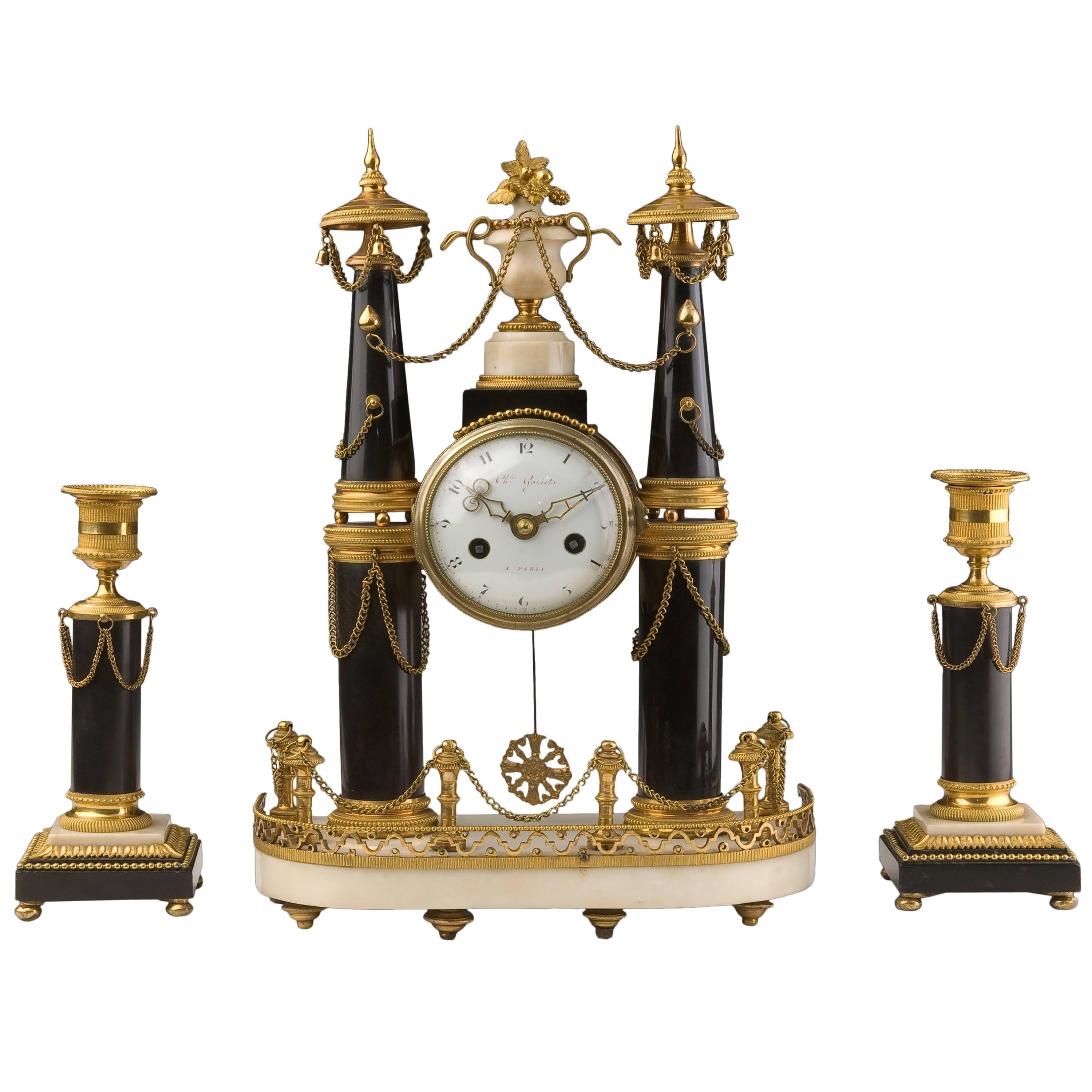 Gilt Bronze Marble Clock and Candlesticks. Louis XVI Period For Sale