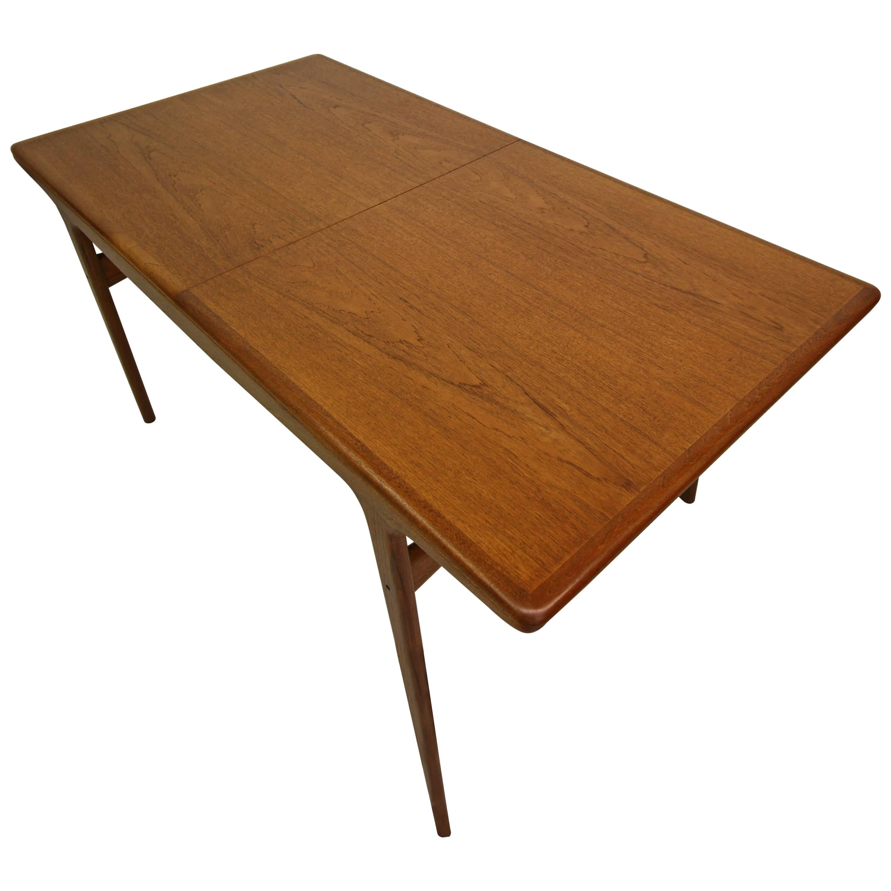 This a beautiful Danish teak dining table by Arne Hovmand-Olsen. Classic in Danish design and very well made as all Johannes pieces are. It has beautiful lines and gorgeous color.

The table is in excellent condition, however the leaves to not