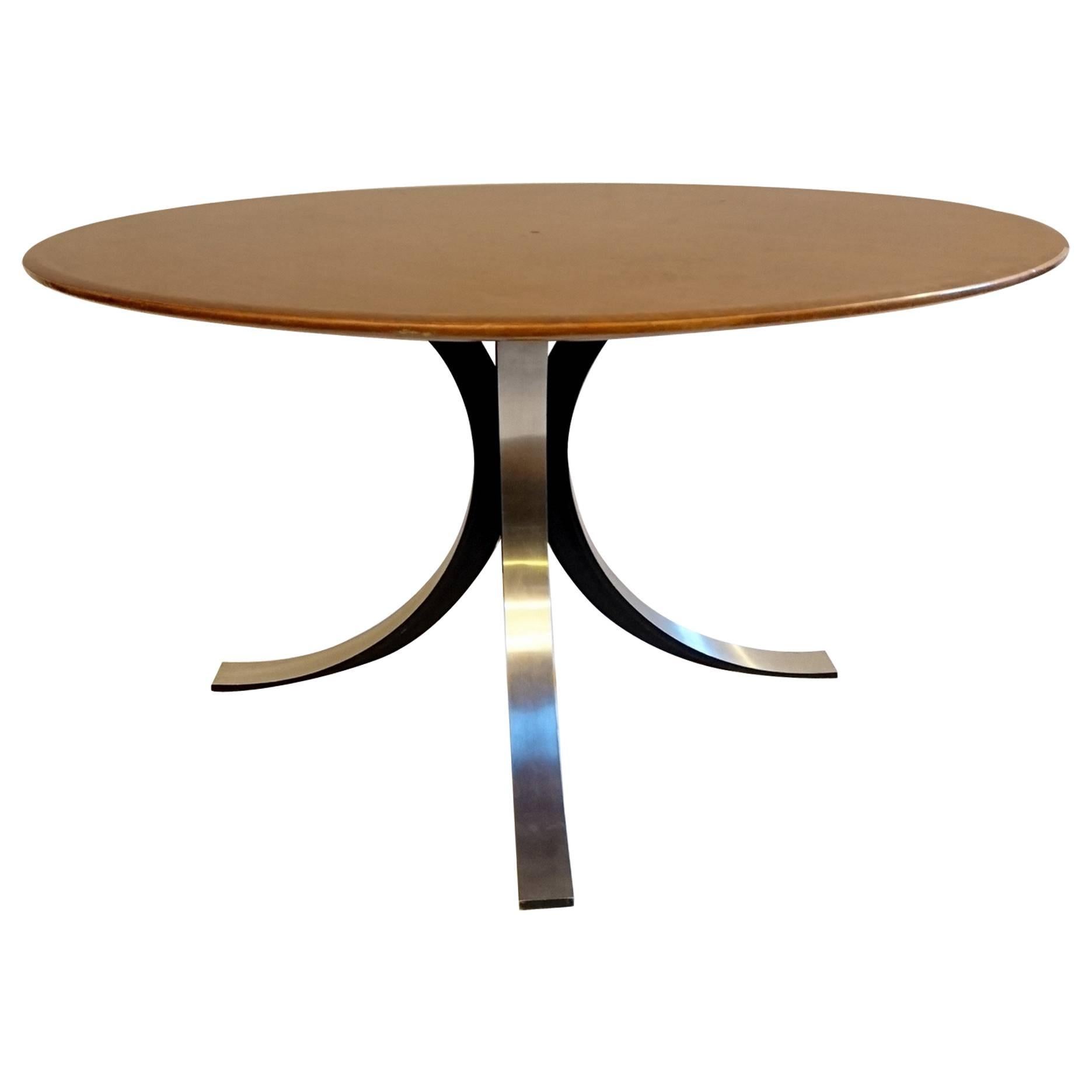 Base in cast steel arches and a round top in varnished maple wood. This T69 model works as a dining or centre table. Height of 65cm.