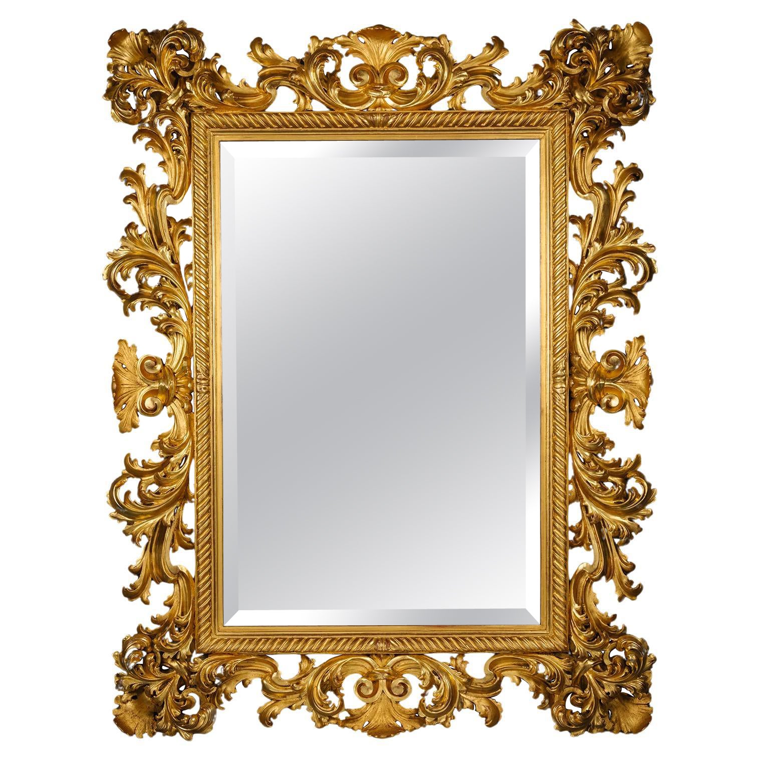 A Large and Impressive Baroque Style Carved Giltwood Mirror