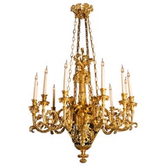 A Gilt-Bronze and Tole Twelve-Light Chandelier, Attributed to Maison Beurdeley