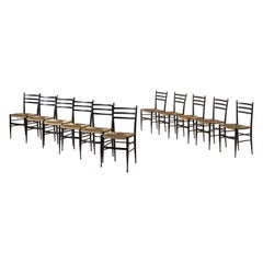 Enrico Delmonte set of 12 ash and straw Gobbetta chairs, Chiavari, Italy, 1950s
