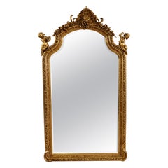 Miroir biseauté Monumental Gold Louis XVI French Style Cherub Putti Motif 7' Tall