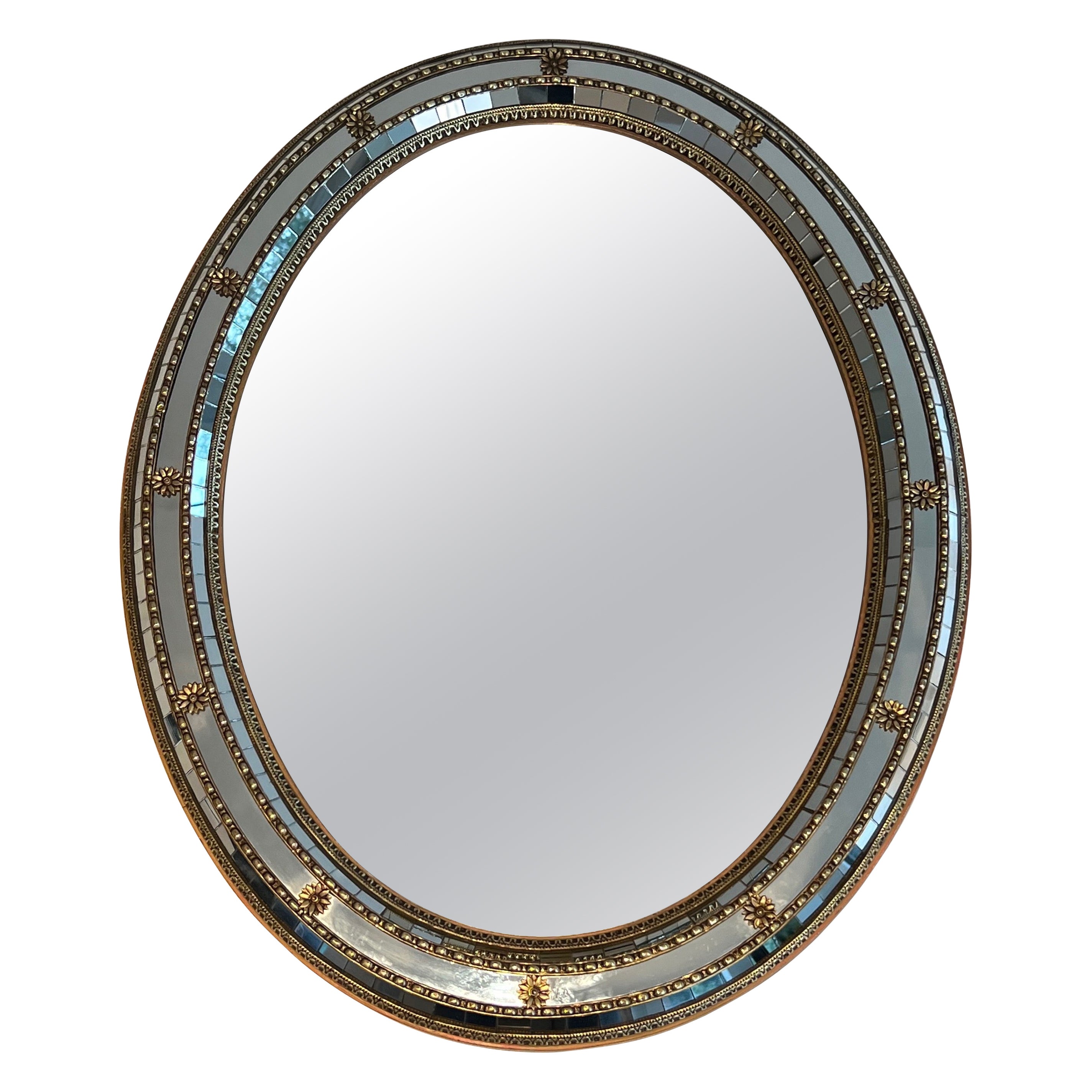 Oval Multi-facets mirror with brass garlands