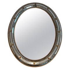 Oval Multi-facets mirror with brass garlands