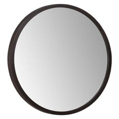Globe circular mirror with leather-covered edge and exposed stitching