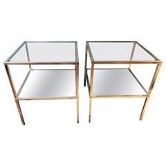 Coppia di tavolini in ottone in stile Willy Rizzo con piani in vetro e specchio