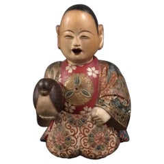 Antique Edo Period Saga Ningyo of a Young Boy Holding a Bird