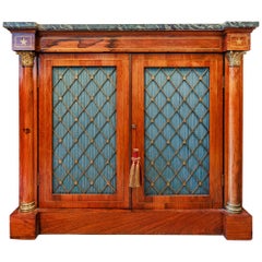 A fine Regency rosewood and brass inlayed  cabinet. Marble top with brass mesh