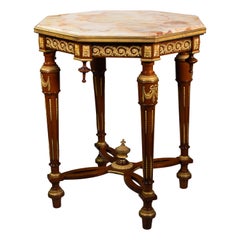 Antique Auxiliary table or “guéridon”. Mahogany, gilt bronze, onyx. 19th century.